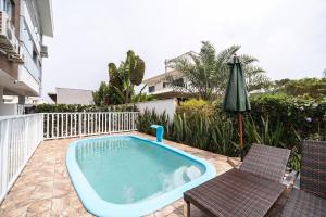 Apto Konzen 2Q perto da praia by Achei Floripa