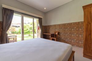 Urbanview Asung 2 Guesthouse near Canggu