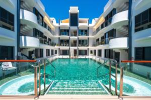 NEW stylish beachside 2BR with pool and garage