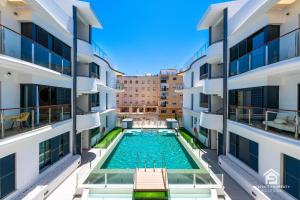 NEW stylish beachside 2BR with pool and garage