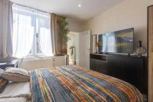 Chambre de luxe Afrik a Liège Grande Sale de bain privée check in autonome cuisine partagée