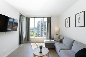 Modern 1BR Condo, Sleeps 4 with Views, AC, Balcony, Near SkyTrain