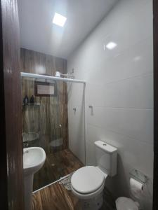 Casa aconchegante com piscina, churrasqueira e garagem, próximo à Praia das Palmeira