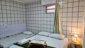 Tiny House - Centro d convenções700m, AC, Wifi, Garagem