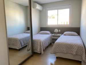 233A - Boulevard Bombinhas 06 pessoas com piscina