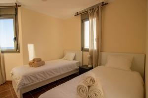 2 bed house near the beach with swimming pools