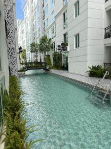 Olympus city garden direct pool access apartment by Sankalp