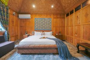 SaffronStays Prince of Kashmir - luxury handcrafted houseboat with mountain views, shikara rides & Kashmiri meals