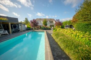 Vakantievilla met zwembad, wellness en glamping in PaalBeringen