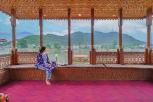 SaffronStays Prince of Kashmir - luxury handcrafted houseboat with mountain views, shikara rides & Kashmiri meals
