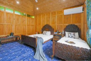 SaffronStays Prince of Kashmir - luxury handcrafted houseboat with mountain views, shikara rides & Kashmiri meals