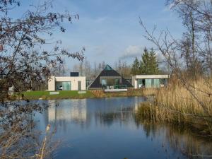 Lovely holiday home Walleken with a pond