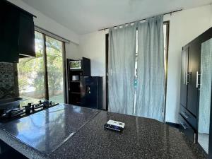 Loft para 4 en casa de huespedes con alberca comun