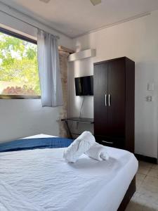 Loft para 4 en casa de huespedes con alberca comun