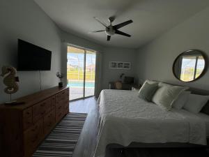 Family Friendly 3BR with Sunset Views Heated Pool Canal Front near Beach