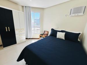 Apartamento frente mar na Praia do Morro - 3 quartos com 1 suíte, ar condicionado e enxoval premium