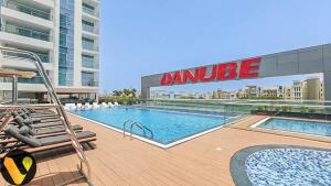 Vogue Vacation Homes, Al Furjan Pearlz by Danube near Ibn Battuta Mall, One Bedroom Apartment with Balcony and Pool View, Access toAmenities, Walkable to Al Furjan Metro Station
