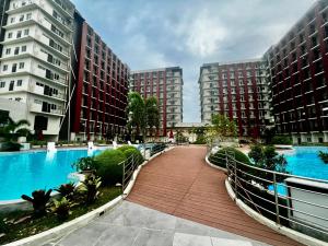Dagos condo Primeworld with balcony and pool view