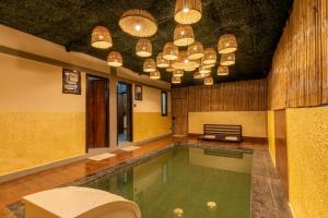 SaffronStays Kurmavana, Bhimtal - luxury cottage with pool and lawn -clear roads