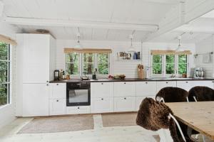 House By Sejerø Bay With Sunset