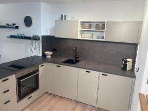 Ambiente Appartement C2 - moderne Ferienwohnung mit Terrasse in Leukerbad