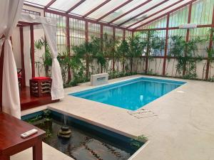 Uva Blue Villas - Pool House - AC, 3 bedrooms, 7 guests, Indoor pool with spill