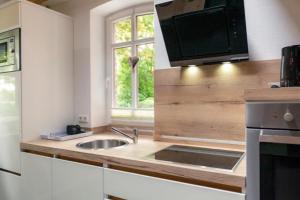 Friesenwind - Hochwertige Ferienwohnung mit Gartenoase