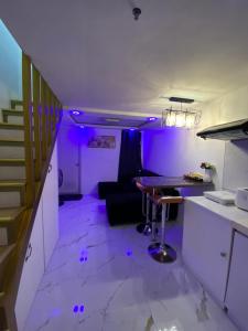 Elegant Golden Loft with Mood Lighting Central Location and Skyline Views