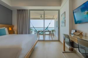 Suite con 2 camas, vista al mar y piscina CB1223