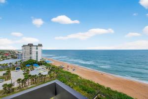 Luxury direct oceanfront corner with a large private balcony, heated pool and garage