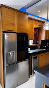 casa con piscina cerca de la playa Caleta 8 mnt de casa de campo Residencial los garcia la romana