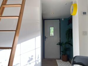 Tiny guesthouse with cozy mezzanine sleeping nook