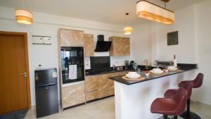 Best Stays Luxury Apartments at Tulip Residences - Beachfront, AC, Lift, Pools