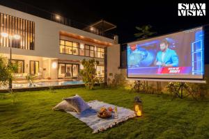 StayVista at The Amaryllis with Heated Pool & Projector Set-Up