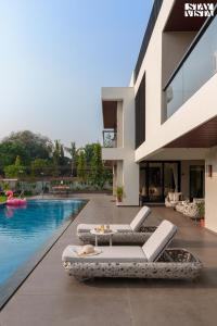 StayVista at The Amaryllis with Heated Pool & Projector Set-Up