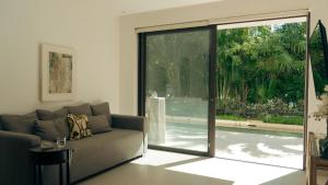 Bright 2BR Apartment with Terrace & Pool, Lorena Ochoa Residences