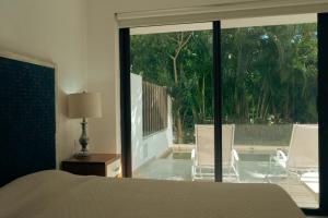 Bright 2BR Apartment with Terrace & Pool, Lorena Ochoa Residences