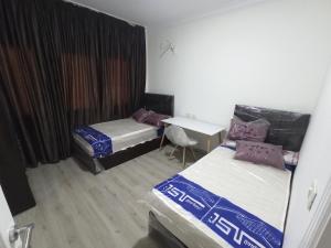 غرف فندقية بجوار الجامعةالاوربية و الكندية والالمانية بكمبوند المقصد العاصمة الادارية