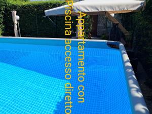 Appartamento con accesso diretto in piscina privata uso esclusivo