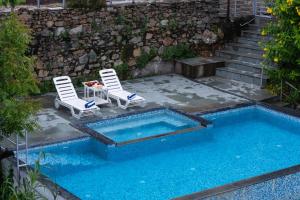 Lake and Hill Pet-friendly 3-BHK Retreat With Private Pool, Bar, Garden, Gazebo & Majestic Aravali Views