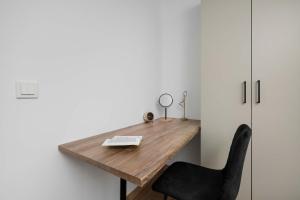 Elegant White Apartment with Terrace & Parking in Wrocław by Noclegi Renters