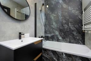 Elegant White Apartment with Terrace & Parking in Wrocław by Noclegi Renters