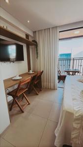 Flat a 50 metros da praia + piscina e área gourmet