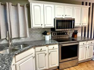 Theater and game rooms 5 bedrooms 2 king size beds TikTok and social media wall