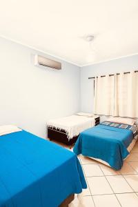 Casa com Espaço Gourmet e Piscina a 2min da Praia de Massaguaçu - Caraguatatuba