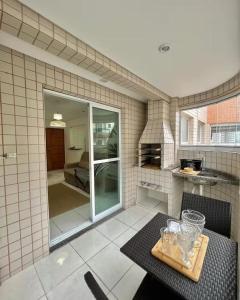 Onda76 Ap temporada Praia Grande Beira Mar churrasqueira carvão