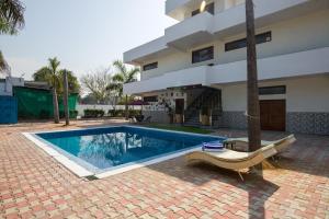 ELIVAAS Ivory estate 5 BHK Farm with Pvt Pool, Gazebos & Lounge Area
