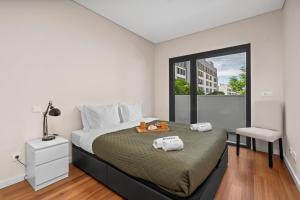 Rooftop Pools & Balcony Haven by HostWise