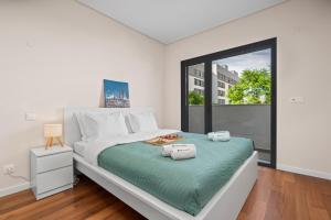 Rooftop Pools & Balcony Haven by HostWise