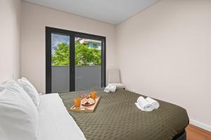 Rooftop Pools & Balcony Haven by HostWise